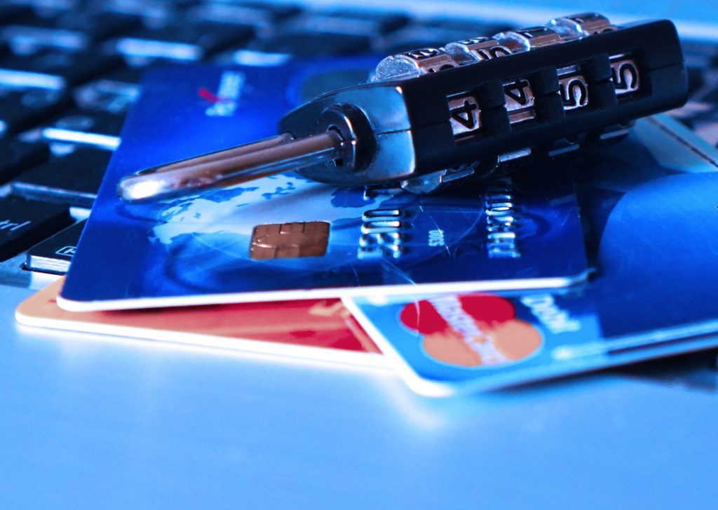 A close up of credit cards and a key, highlighting potential truth in lending act violations.