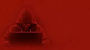 Red image of a computer hacker making unauthorized transfers depicting when Schlanger Law Group may be able to help
