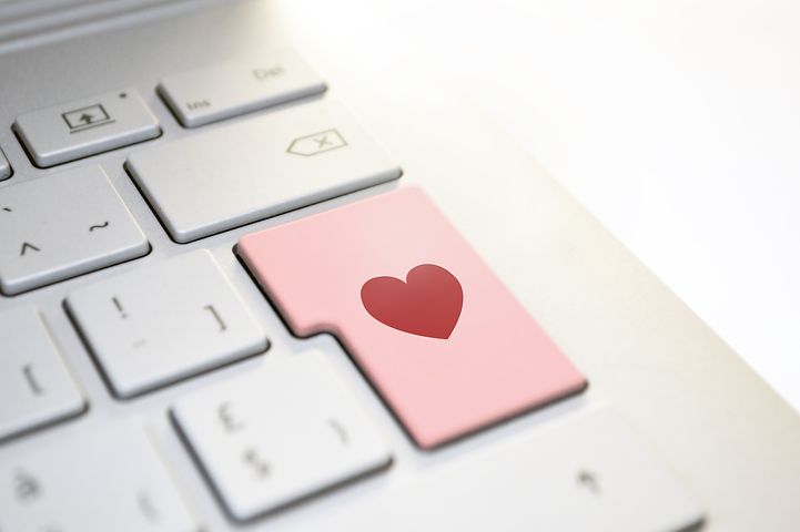 photo of computer keyboard with a love key depicting how Schlanger Law Group can protect victims of online romance scams