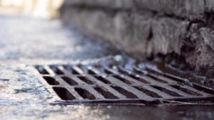 Photo of a street sewer depicting the improper service of process New York sewer service problems Schlanger Law Group helps consumers resolve
